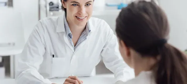 Nurse Practitioner with DNP Speaking with Patient